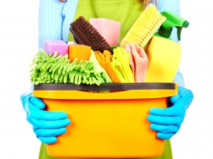Maid hands with cleaning tools. House cleaning service concept.