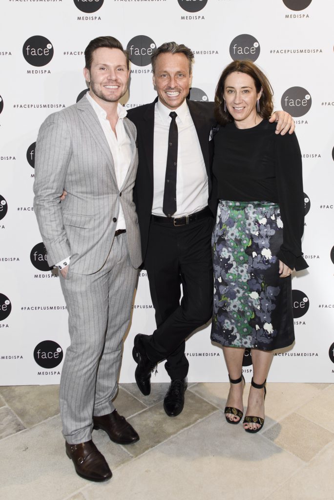 Dr Will Mooney celebrates with Nick Smith from GQ and Edwina McCann, Editor at Vogue. Photo: Esteban La Tessa