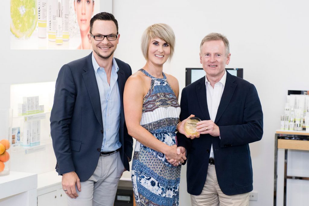 Sharnelle Mitchell winning her award for Best Beauty Therapist from Ultraceuticals' Dr Geoffrey Heber and CEO, Olivier Duvillard.