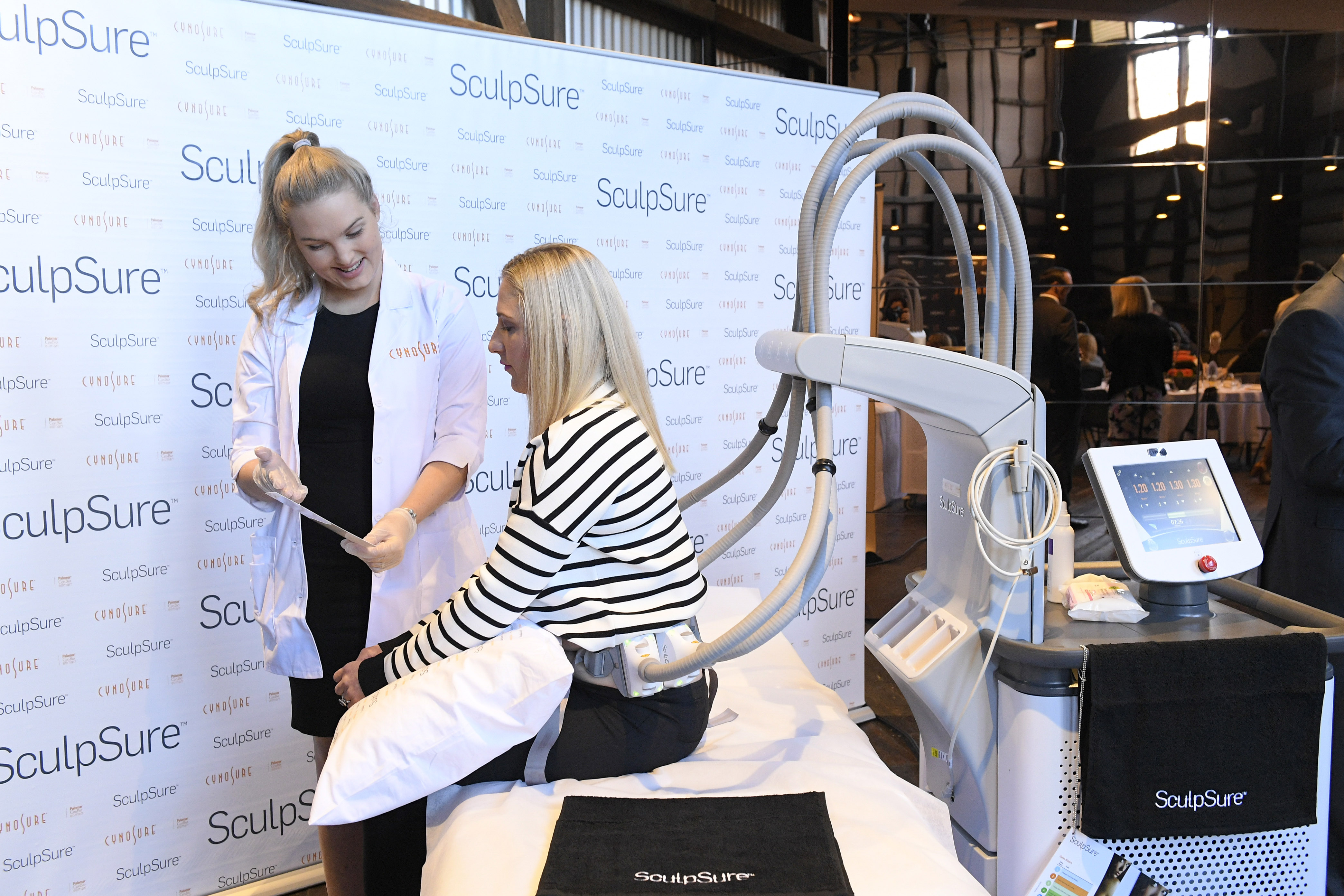 Demonstrating the new SculpSure machine. Over half the women surveyed said they were open to alternative body sculpting methods like laser.