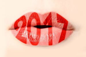 2017 written with red lipstick on girl lips